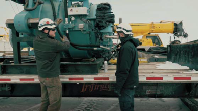 AMSOIL technicians servicing wind turbine